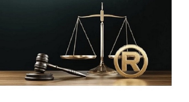 Trademark and patent law icon with gavel and scales